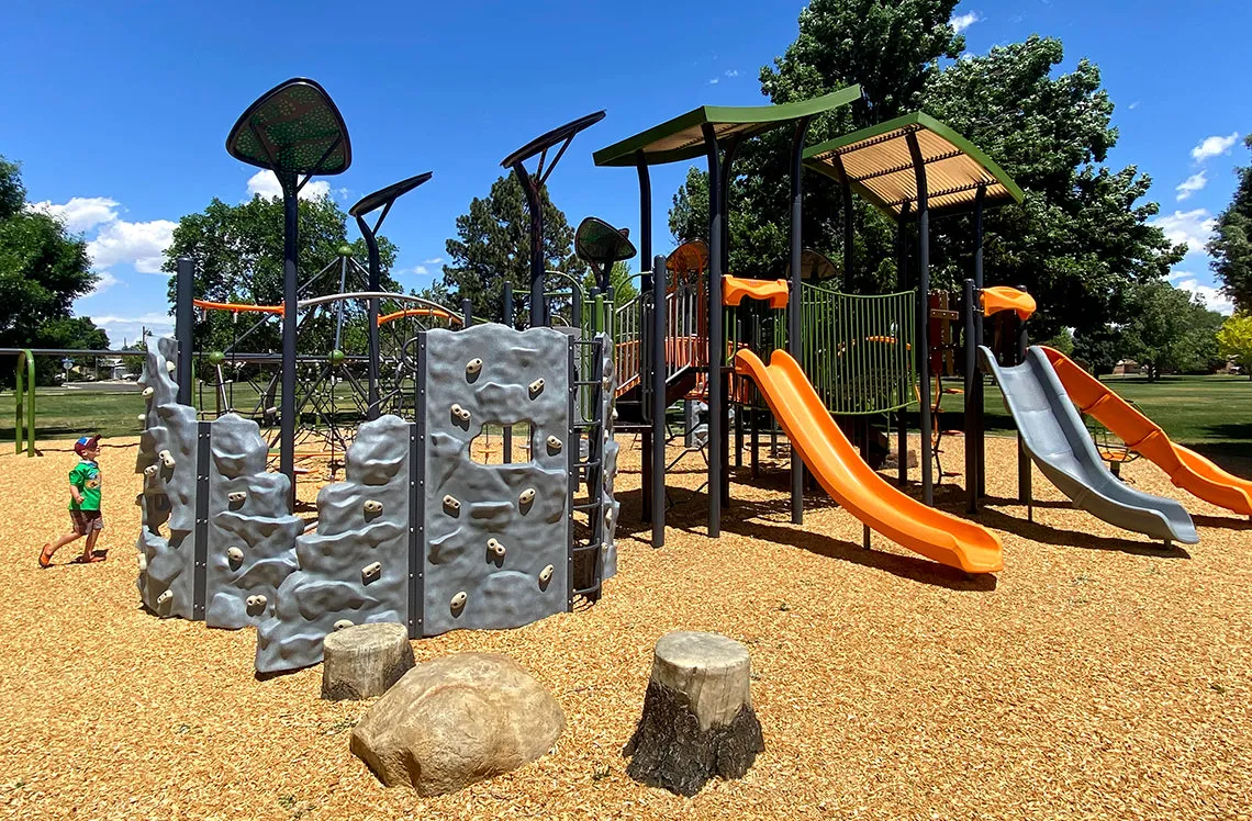Rockwall and slides on wood mulch at Sherwood Park